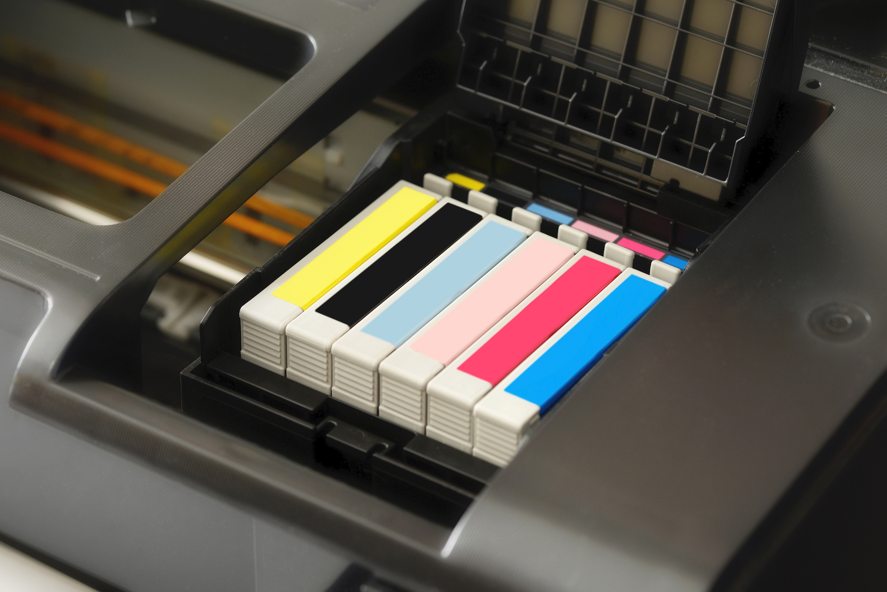 Row of individual ink cartridges in a printer