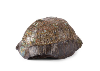 A tortoise shell with various portraits and maps in the shell's various sections.