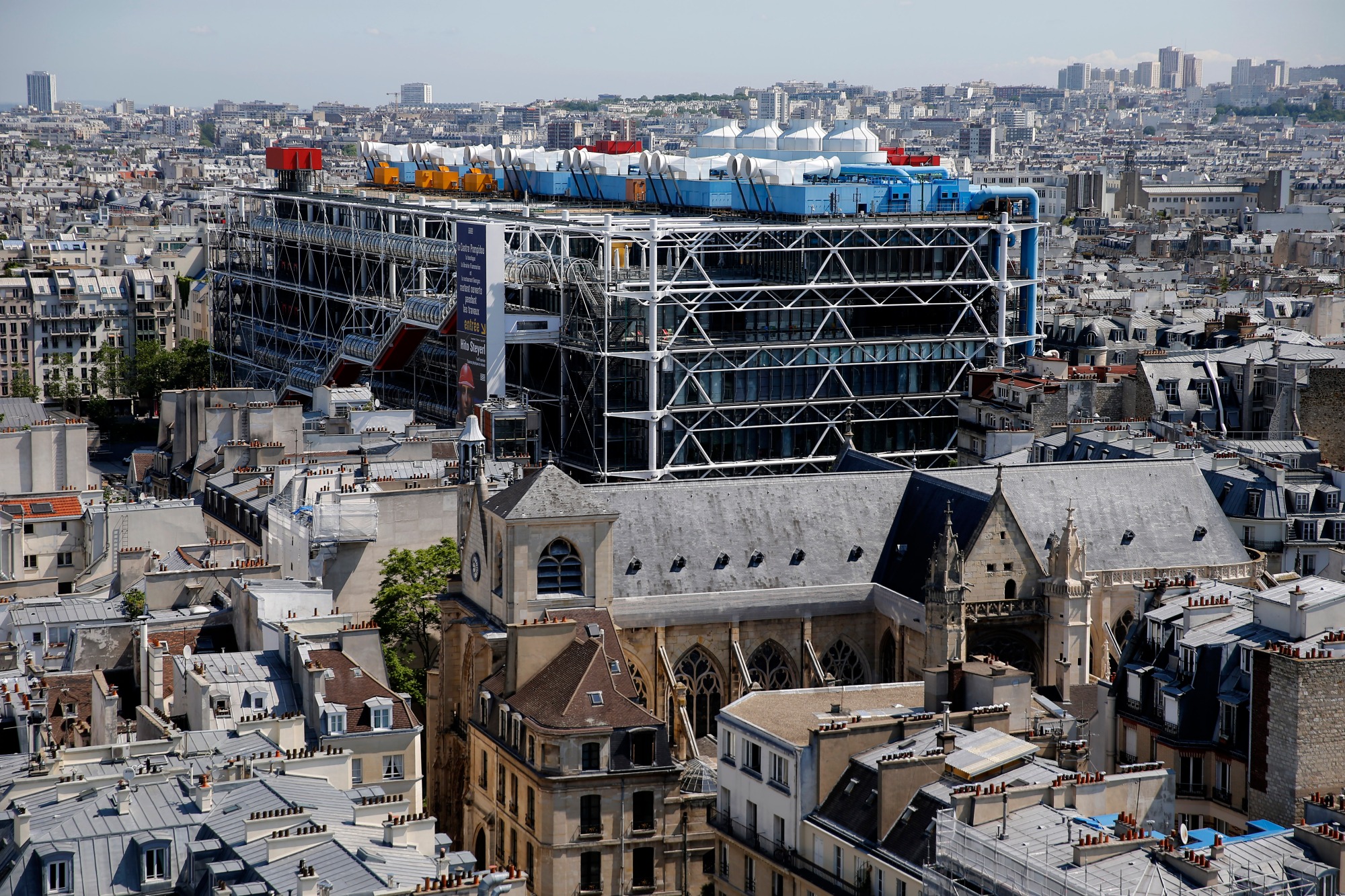 PARIS, FRANCE - JUNE 07: The Georges Pompidou National Center for Art and Culture, commonly known as the Centre Pompidou, or more colloquially, as "Beaubourg" is seen from the zinc-topped terrace of the Saint-Jacques Tower (Tour Saint-Jacques) on June 7, 2021, in Paris. The Saint-Jacques Tower reopens to the public after being closed due to COVID. From May to November, the UNESCO World Heritage site offers visitors who ascend the 52-meter tower and 300-step spiral staircase a breathtaking 360-degree view of the French capital. This flamboyant 16th-century Gothic tower, a passageway for pilgrims to Santiago de Compostela in Spain, has been closed to the public for most of its 500-year history. (Photo Chesnot/Getty Images)