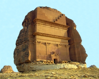 A large structure carved into the side of a stone.