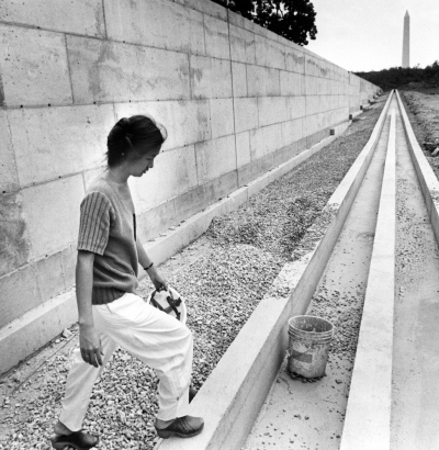 Maya Lin, designer and architect of the Vietnam Memorial, visiting the construction site on July 12, 1982.